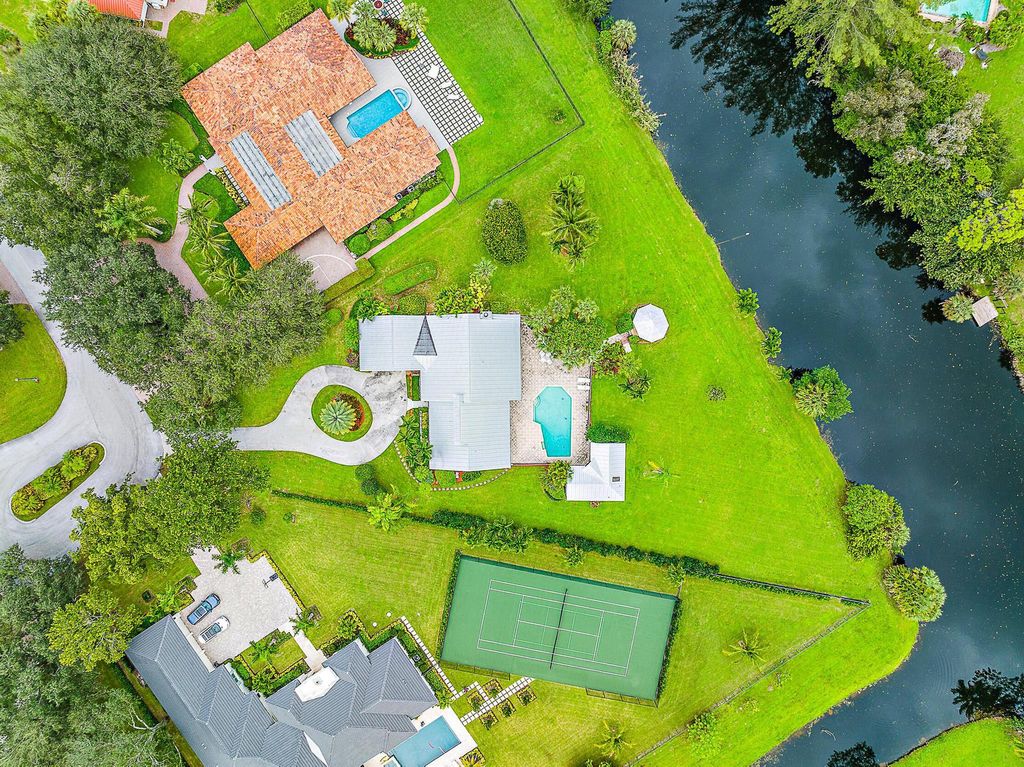 Photo of 5561 Whirlaway Road, Palm Beach Gardens, FL 33418 (MLS # R10928028)