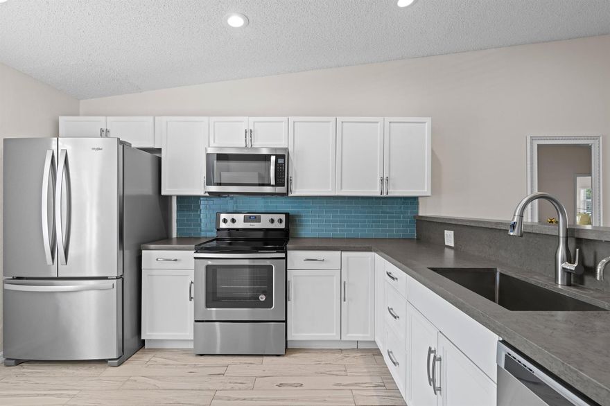 Beautifully updated 2-bedroom, 2-bath condo designed for 55+ living, offering the feel of a private residence. This home features modern bathrooms, a kitchen with stainless steel appliances, fresh interior paint, and ceramic tile flooring throughout. The enclosed Florida room adds valuable living space, and the convenience of an in-unit washer and dryer enhances everyday comfort.Recent upgrades include a newer roof (2022), water heater and air conditioner (2019), plus impact windows and sliding glass door for added safety and efficiency. Two designated parking spaces are included.Located in a gated 55+ community, residents enjoy resort-style amenities such as pickleball and tennis courts, heated pool, Jacuzzi, sauna, exercise room, shuffleboard, pool table, and library. Ideally