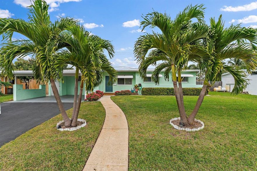 Mid Century Modern done to PERFECTION! 
Awesome move-in ready CBS home in the Village of North Palm Beach! Adorable curb appeal with new landscaping and welcoming front porch. Tons of natural light fill this adorable with through the newly installed impact windows. The modern white kitchen and bathrooms were recently updated but the ''Old Florida Charm'' remains with beautiful Terrazzo flooring throughout.  The open Florida room adds lots of extra living space and flows perfectly out to the full fenced and private backyard. This home is perfectly located just minutes away from beaches, shopping and restaurants. NO HOA! Great investment opportunity with no rental restrictions! Don't miss this gem!