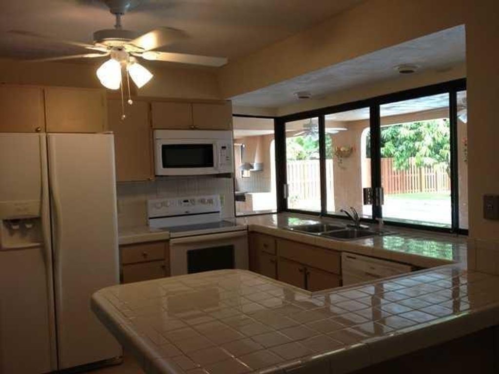Photo of 737 NW 84th Lane, Coral Springs, FL 33071 (MLS # B26024869)