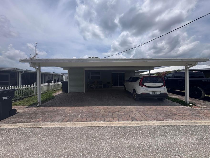 This spacious canal-front home in River Bluff features an inviting open floor plan with a large great room, cozy brick fireplace, and eat-in kitchen. Boaters - enjoy quick and easy access to the Kissimmee River and short jaunt to Lake Okeechobee! Enjoy beautiful canal views from the expansive enclosed porch, perfect for relaxing or entertaining. The home also offers plenty of storage space and covered front parking for up to three vehicles. Boathouse and dock included. Information provided in the MLS is believed to be accurate but not guaranteed. Buyers should verify all information. Property sold As-Is.