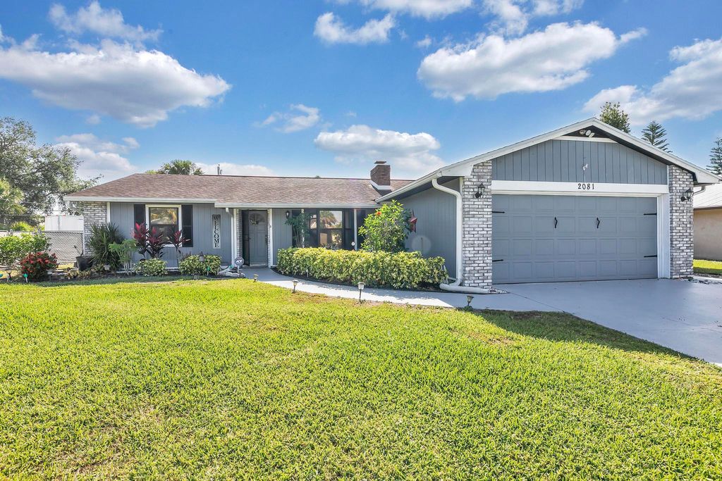 Photo of 2081 SW Aguero Street, Port Saint Lucie, FL 34953 (MLS # R10794805)