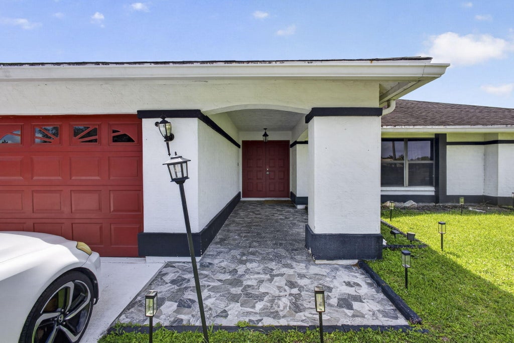 Photo of 106 Segovia Court, Royal Palm Beach, FL 33411 (MLS # B26033994)