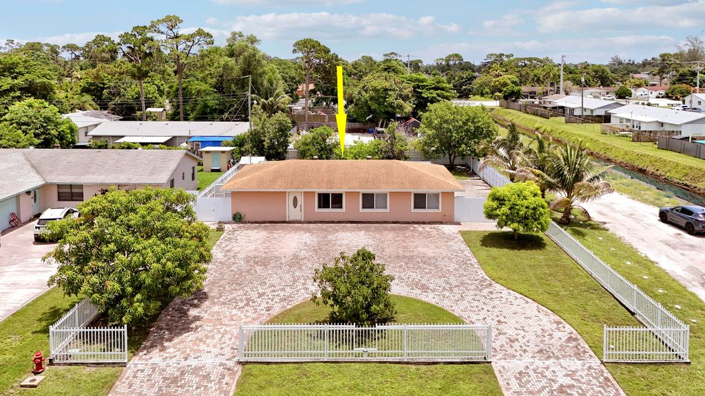 Photo of 2488 Pineway Drive, West Palm Beach, FL 33415 (MLS # B26054093)