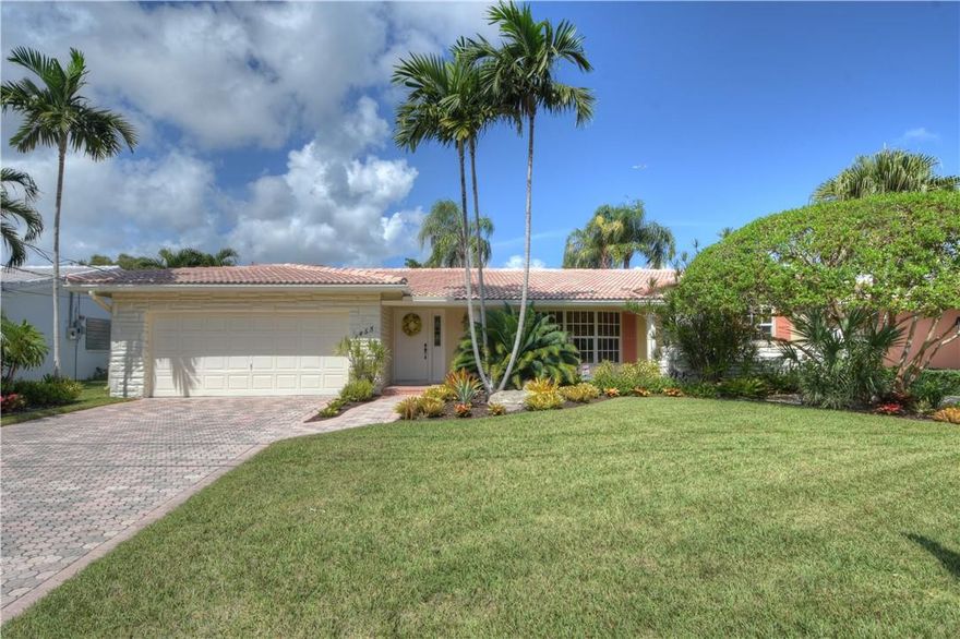 One of the subdivisions largest models, rarely on the mkt! A true 4 bed, 2 bath with separate family rm, living rm, dining rm, laundry rm, 2 cg, pool & waterfront! Large primary bedrm with 2 walk in closets, bath with dual sinks & large shower. All new porcelain long plank, light wood grain, waterproof tile throughout! Solar panels for the water heater, upgraded kitchen and baths, impact windows & doors, new washer & dryer, new pool heater, separate irrigation meter. New electrical panel being installed prior to closing! House exterior sealed and repainted 4/2021, New pool heater & pool pump. Whole house generator! Ocean Access waterfront: There are 5 fixed bridges, the lowest is the McNab bridge which is slated to be raised but is currently 6' at high tide. Boaters are better off to have a folding or Bimini top on their boat so they have more flexibility with the bridges. It' approximately 20-25 minutes to the Intracoastal waterway because it's a NO wake zone. Then another 25 minutes to the Hillsboro Inlet.