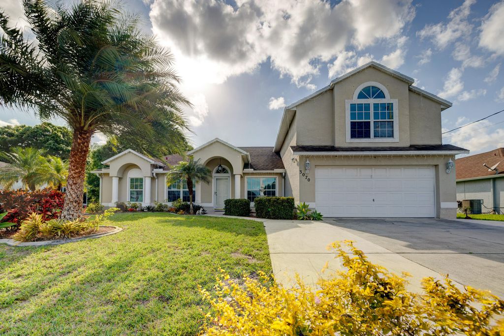 Photo of 3070 SW Bridge Street, Port Saint Lucie, FL 34953 (MLS # R10786391)