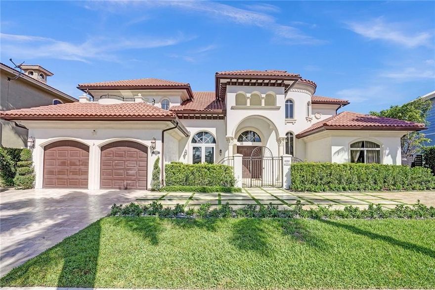 Bring your Yacht! Step into this exquisite waterfront two-story gated residence, sprawling over 4500 sq ft. This masterpiece features 4 bedrooms, 3.5 baths, high-volume ceilings, grand spiral staircase, marble floors, 2 dining rooms, 2 living rooms, open concept new kitchen adorned quartz counter tops. The main suite boasts 2 private balconies, oversized main bathroom with dual sinks, whirlpool spa shower & tub & 3 walk-in closets. Impact windows/doors, 2 car garage with epoxy floor, wired for Tesla. Expanded driveway, newer A/C units, Salt-water pool with kitchen w/electric. Custom wired sound system. 80' of dock space, deep water, minutes to the Intracoastal. Dredged 5 yrs ago for 70ft+ yacht, renovated Seawall/pilings, Jet-ski dock. No fixed bridges. Spacious patio w/travertine pavers.