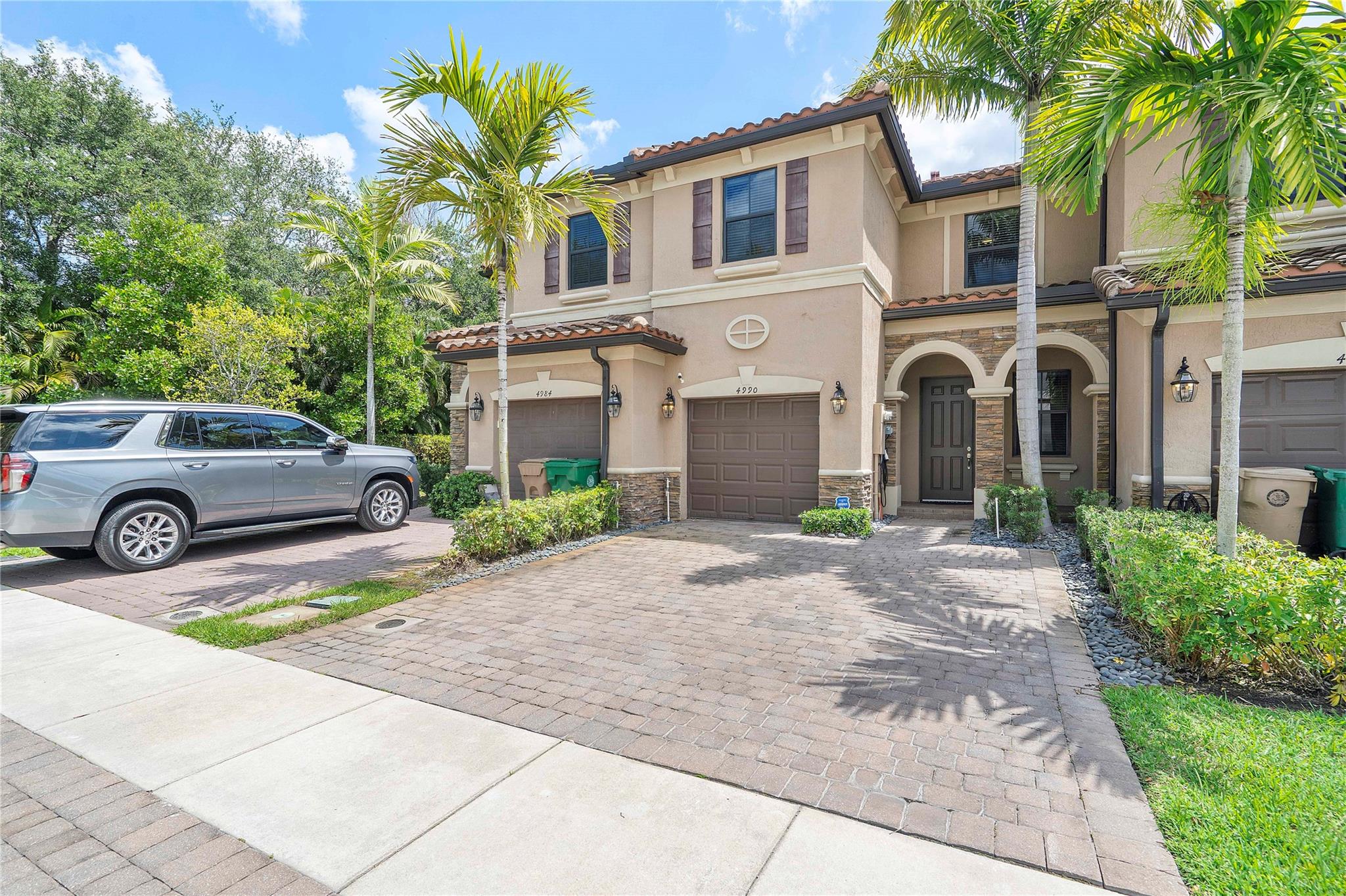 Built in 2019, this move-in-ready townhome has been lovingly cared for and shows like new! Featuring 3bed, 2.5bath, and laundry upstairs, this home also includes a 1-car garage and impact windows throughout. The spacious layout offers a living room, dining area, and family room for easy entertaining. The kitchen shines with quartz counters, stainless steel appliances, white shaker cabinets, and recessed lighting. Enjoy tile floors on the first level and upgraded ceiling fans throughout. The primary suite boasts a walk-in closet, dual sinks, and a walk-in shower. Outside, relax in your private, fenced-in patio with pavers. Extras include a tankless water heater and electric car charger. Centrally located near the Turnpike, top colleges, Hard Rock Casino, restaurants, and shopping.