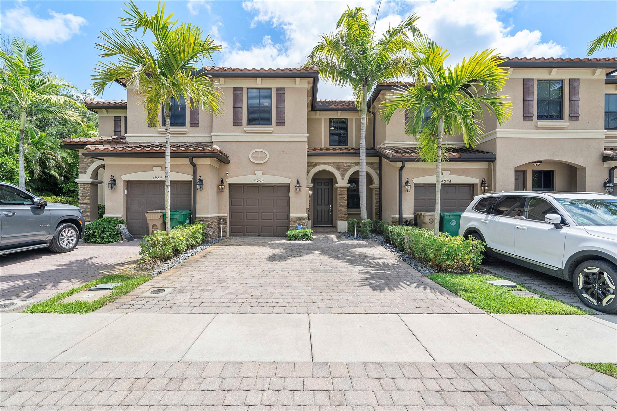 Built in 2019, this move-in-ready townhome has been lovingly cared for and shows like new! Featuring 3bed, 2.5bath, and laundry upstairs, this home also includes a 1-car garage and impact windows throughout. The spacious layout offers a living room, dining area, and family room for easy entertaining. The kitchen shines with quartz counters, stainless steel appliances, white shaker cabinets, and recessed lighting. Enjoy tile floors on the first level and upgraded ceiling fans throughout. The primary suite boasts a walk-in closet, dual sinks, and a walk-in shower. Outside, relax in your private, fenced-in patio with pavers. Extras include a tankless water heater and electric car charger. Centrally located near the Turnpike, top colleges, Hard Rock Casino, restaurants, and shopping.