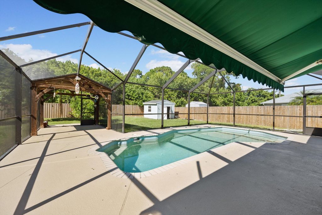 Photo of 2230 SE Dill Lane, Port Saint Lucie, FL 34952 (MLS # B26044307)
