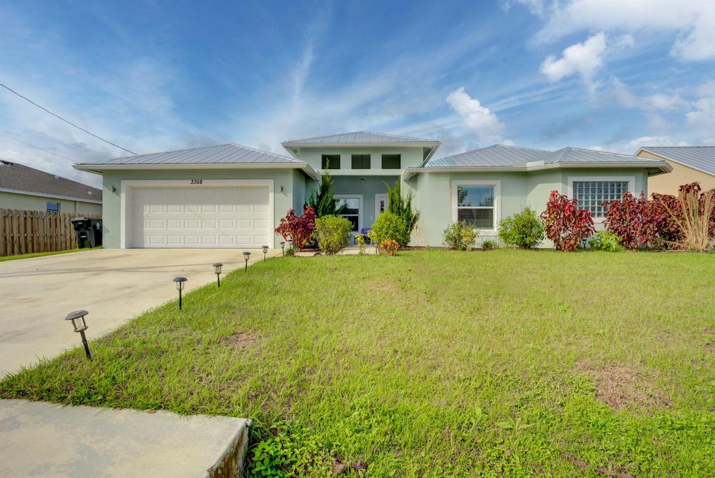 Photo of 3358 SW Martin Street, Port Saint Lucie, FL 34953 (MLS # R10943518)