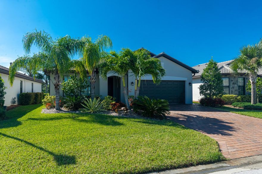 Stunning 2020-built waterfront 4BR/3BA/2CG loaded w/$50K+ in owner/builder upgrades. Elegant open-concept design features tile flooring throughout, high-impact glass, stylish lighting. The gourmet kitchen boasts gas cooking, ss appliances, pantry & breakfast bar seating. Spacious primary suite offers tray ceiling, dual sinks, tiled walk-in shower & large walk-in closet. Step outside to a fenced backyard, extended covered and screened lanai with TV,  located on C-23 canal. Additional upgrades include epoxy garage flooring, extra attic storage, laundry tub, front-load washer/dryer and roll shade on the patio slider. Low HOA dues w/community amenities, fitness center, pool, pickleball, convenient location close to shopping, & dining.