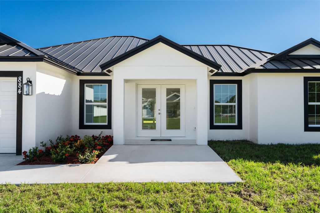 Photo of 884 SW Thrift Avenue, Port Saint Lucie, FL 34953 (MLS # R11150875)
