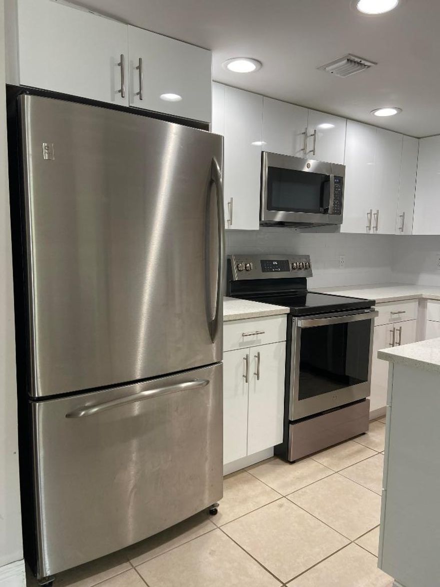 Welcome to this all ages community hidden away in beautiful Palm Springs, FL, Centrally located and close to everything. This home boasts newly renovated bathrooms and kitchen, as well as recently updated stainless steel appliances. Sparkling quartz countertops, a spacious living space, and a roomy outdoor patio with privacy fence make this home the perfect space to relax. Water and cable included. The community also has a pool area for residents to enjoy. Pets and work trucks welcome. Overnight guest parking available. Easy HOA application. Make this move in ready home in the sought after Fairview Villas community your new home today!