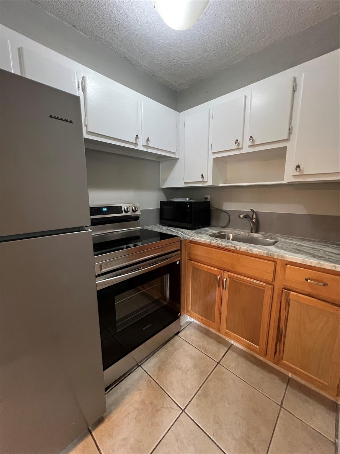 First floor 1/1 apartment with tile floor throughout and updated bathroom with walk in shower. Kitchen Updated with lower cabinets, stainless steel appliances with new granite countertop. Mini split wall unit a/c. Pool and laundry facilities on site. Non refundable application fee $50 for credit/background reports. No pets. One assigned parking space only, no guest spaces. Water, sewer and trash included in the unfurnished annual rent. Minimum one year lease. Lots of storage. Close to shopping/dining/beach and highways. No pets.