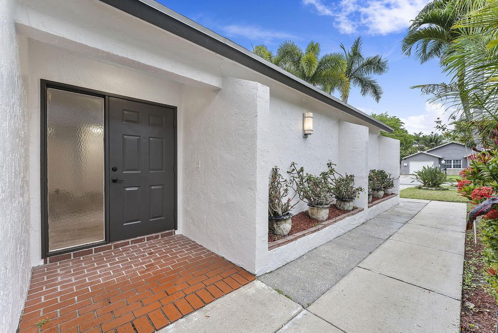 Photo of 9180 Pine Springs Drive, Boca Raton, FL 33428 (MLS # R11066193)