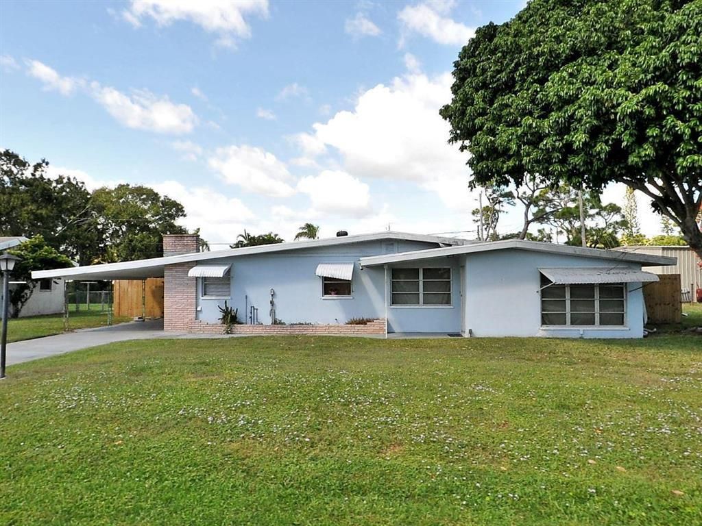 Photo of 330 Shady Lane, Port Saint Lucie, FL 34952 (MLS # R10718161)