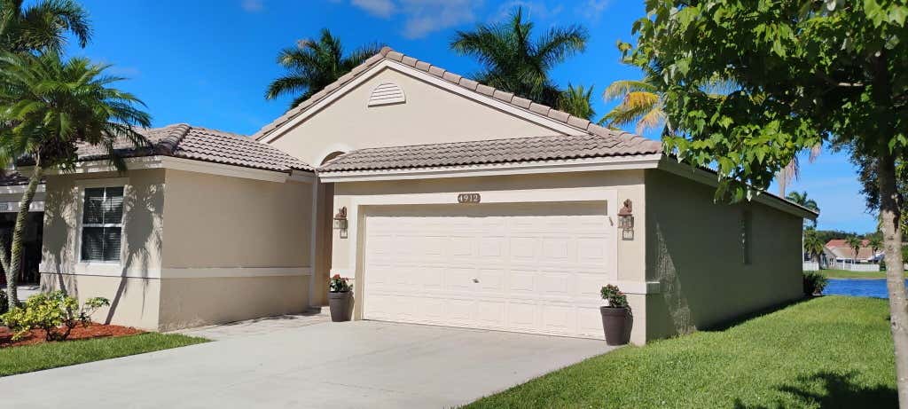 Photo of 4912 NW 55TH Boulevard, Coconut Creek, FL 33073 (MLS # B26063427)