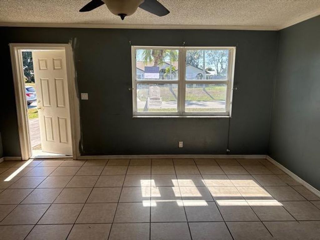 Photo of 321 NE Genesee Avenue, Port Saint Lucie, FL 34983 (MLS # F10548841)