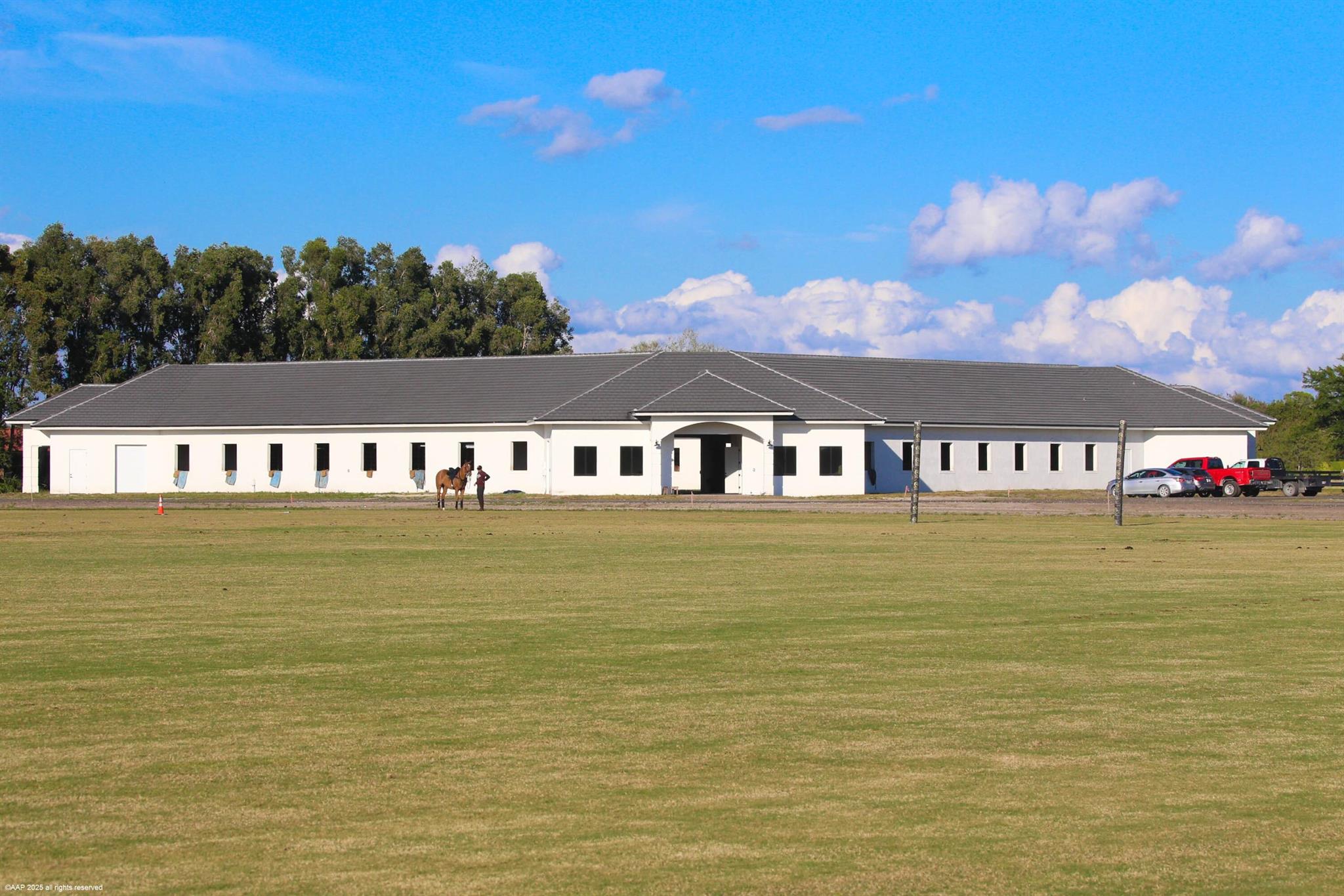 Newly constructed 52 stall show barn with huge grass riding situated on 9.07 acres with no home owner's association restrictions! This property is ready for your custom finishes and offers a wide variety of options for use. Layout the equestrian amenities as you wish. There is plenty of room for a single-family residence, covered arena, outdoor arena and more. The property is high and dry.