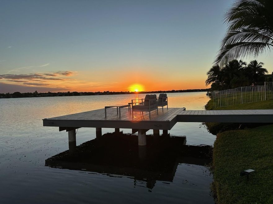 Modern, fully upgraded lakefront smart home in a private Pembroke Pines community. This stunning 3/2 features porcelain tile throughout, impact windows/doors, custom closets, elegant bathrooms, and a luxury kitchen with solid wood cabinetry, premium counters, stainless appliances, and a wine cooler. The finished double garage adds flexible living with A/C, LED lighting, and matching tile. Enjoy seamless smart control of lighting, climate, irrigation, water filtration, and security. Step outside to a resort-style backyard with a maintenance-free dock, solar lighting, built-in speakers, a sleek covered patio, and a modern pergola — all overlooking peaceful lake views. Move-in ready perfection!