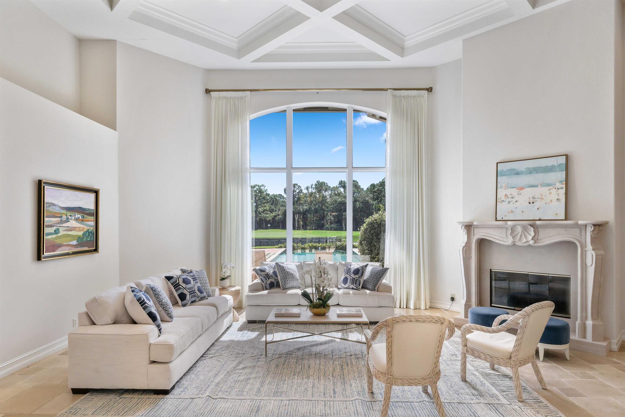 Perfectly situated on over 2/3 of an acre, this cul-de-sac residence offers some of the best views in Old Marsh. Enjoy SE and extensive views of the water, nature preserve, and the signature 8th hole of the Pete Dye championship course. The custom home features high ceilings, impact glass, a renovated open kitchen, updated pool and lanai, and a flexible layout with both a great room and family room, plus formal dining, breakfast nook, butler's pantry, wet bar, and a richly detailed study. The primary suite includes dual bathrooms, two walk-in closets, and a private sitting area overlooking the grounds. Additional highlights include a newer roof (2019), powder and cabana baths, and generous indoor-outdoor living for everyday comfort and effortless entertaining. Set within the​​‌​​​​‌​‌​​​‌‌​​​‌‌‌​​‌​​‌‌​​​​ private,