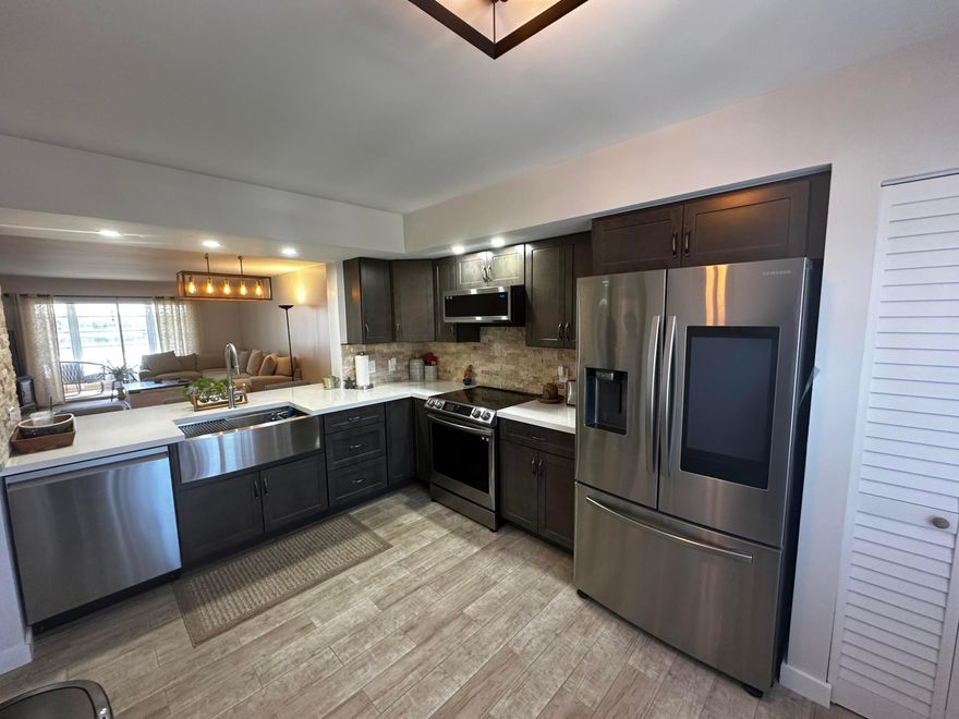 Discover this beautifully renovated 2-bedroom, 2-bathroom condo in the highly sought-after Century Village active adult community of Pembroke Pines, Florida. This bright and spacious unit boasts brand-new ceramic tile flooring throughout, creating a clean and modern look. The kitchen has been completely updated with custom cabinetry and features all new stainless steel appliances. Enjoy breathtaking sunset views from your private screened balcony - perfect for relaxing evenings,  this move-in-ready home offers comfort and style. Century Village residents enjoy an incredible lifestyle with resort-like amenities including multiple swimming pools, an 18-hole championship golf course, a state-of-the-art fitness center, tennis and pickleball courts, a grand clubhouse with theater.