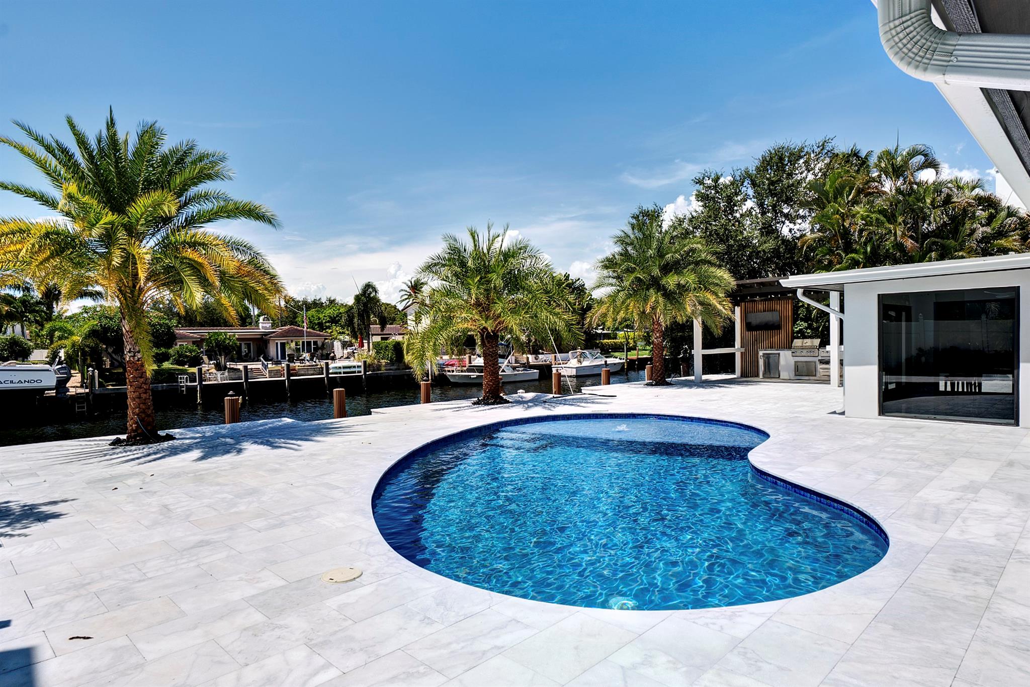 Amazing Opportunity To Purchase This COMPLETELY RENOVATED WATERFRONT HOME in the Heart of Lighthouse Point! Located MINUTES to the Intracoastal with NO FIXED BRIDGES on one of the widest canals in the city, this home HAS IT ALL! This home features: Impact Windows & Doors, GORGEOUS Kitchen with State of the Art Kitchen Aid Appliances, Stunning Primary Bedroom with LARGE Walk In Closet w/ Custom Built Ins, Primary Bath Features Soaking Tub and HUGE Walk In Shower W/ A Rain Shower Head & Body Jets, 80 Ft Dock With Newer Seawall & Cap, RESORT STYLE Backyard with Marble Patio, Pool, CUSTOM BUILT LANAI with Built In Kitchen! This Home backs SOUTH and is SURROUNDED BY NEW CONSTRUCTION! A MUST SEE, BRING YOUR BOAT & TOOTHBRUSH *Note: Some Photos are Virtually Staged*