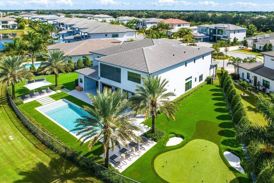 Live the ultimate FL lifestyle with this turn-key, custom SMART home, set in a private cul-de-sac, with almost 1/2 an acre of lake views. This contemporary, open floor-plan Riverside model, with 5 VIP suites & 6.5 baths, can only be found in Boca Bridges. Meticulously designed by IG Workshop, this entire residence flows from inside to outside, with no detail overlooked. Highlights include: 10'' engineered wood plank flooring, custom millwork, dream kitchen with Calcutta marble protected by Tuff skin 2x sinks, 2x dishwashers, 3 ovens & Subzero/Wolf appliances. Turfed yard with custom pool/spa, 40 yard par-3 putting with English-style pot bunkers, in-ground trampoline, landscaping, lighting and surround sound. Lot has room to build a 1-story pool/guest house. See supp for full upgrade list.