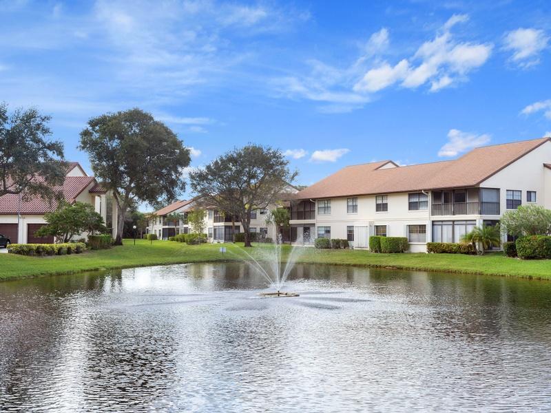 Breathtaking lake view from this 2nd floor 2 bedrooms 2 bath condo with a den! Absolutely immaculate and gently used by snowbirds. Newly installed hurricane impact glass on all windows and accordion shutters in the Florida room for complete hurricane protection. Great open floor plan with vaulted ceilings. Newer refrigerator and glass-top stove and new kitchen counters. AC and water heater replaced in 2014. Full-size washer and dryer. Bamboo floors in master and guest bedrooms.Large master suite with a walk-in and an additional closet, master bath with double vanity and separate shower. Large Florida room to enjoy the beautiful view! Furniture included in the sale. Park Pointe is a well-maintained 55+ community with clubhouse, pool, tennis.