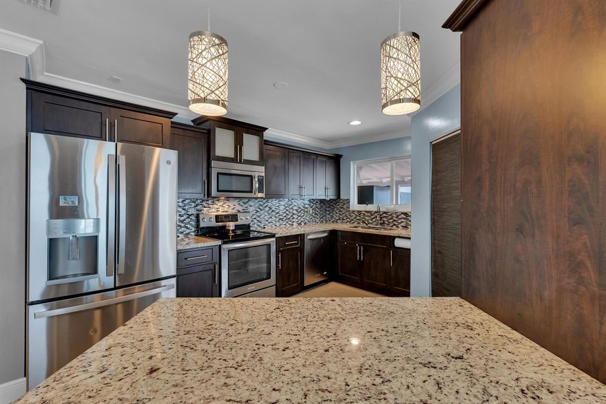 Are you ready for a single family home with low maintenance.  Brand new AC, Remodeled kitchen, impact windows 2020 and new roof 2019 in this Pembroke Pines home.  Paved and covered outdoor space to entertain and enjoy yourselves. Minimal landscaping to maintain.  Garage has been converted for an office or could be a third bedroom.  Could easily be converted back.  Laundry inside garage/office. Great starter home or to downsize from a larger one and take things easier. The paved backyard has been engineered with pebble underneath for drainage.  Great starter home or age in place.