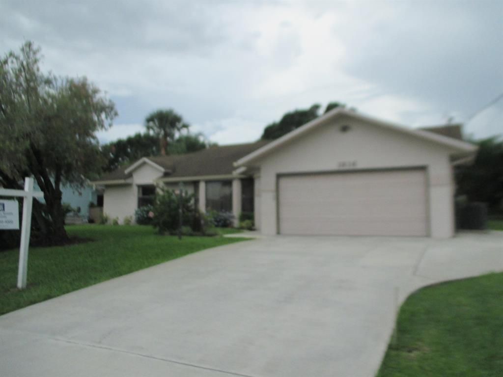 Photo of 1816 SW Beeker Street, Port Saint Lucie, FL 34953 (MLS # R10729033)