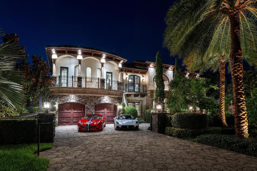 Welcome to Villa Tremezzo — a privately gated West Coast Contemporary masterpiece in Lighthouse Point's most prestigious estate enclave.

Created for the world's most discerning buyers, this extraordinary waterfront estate delivers enduring, generational value with architecture and finishes that transcend fleeting trends. Set behind soaring granite walls and positioned far back from the street, Villa Tremezzo offers rare privacy and presence, complemented by 92 feet of deep-water frontage and an unmatched wide-water panorama so serene and expansive it surpasses even Intracoastal vistas. Designed and constructed by a renowned builder-owner, this architecturally bold residence is inspired by iconic celebrity estates and executed without compromise. Every element was curated for permanence, performance, and peace of mindfar exceeding the standards of today's new construction.

The estate has been comprehensively re-engineered for modern luxury living, featuring a brand-new roof, new AC systems, fully replaced ductwork, and advanced Control4 smart-home automation with integrated security, lighting, and audio throughout. A whole-house generator, Thermador appliance suite, steam rooms on multiple levels, private elevator, and elevated infrastructure ensure seamless living at the highest level.

Custom double iron doors open to reveal a breathtaking interior where 28-foot ceilings, a dramatic two-story fireplace, and panoramic water views define the grand living space. Natural elementsflowing water, ambient fire, imported cherry wood, and nearly $1 million in premium marble and stonecreate a refined interplay of warmth and scale. The open-concept design flows effortlessly into a chef's kitchen engineered for both performance and visual impact.

A first-floor clubroom serves as a refined entertainer's retreat, complete with full bar, wine storage, pool table, and dual TVsequally suited for intimate evenings or grand celebrations.

Outdoors, the estate unfolds into a private resort experience: an ozone-purified saltwater lagoon pool with beach entry, waterfalls, dual grottos, spa table, oversized Jacuzzi, putting green, and sculptural fire features. Multiple covered loggias, an outdoor kitchen and dining pavilion, and a jet-equipped sun shelf extend luxurious living into every season.

The custom home theater offers a true cinematic escape, featuring seven leather reclining seats, a 135-inch screen, a programmable star-lit dome ceiling, and a dedicated lobby with concessions, bar, and powder room.

The upper-level primary suite is a sanctuary unto itself, complete with fireplace, built-in sound, electric shades, private balcony, and concealed safe. The spa-inspired bath features dual vanities, bidet toilets, a two-person steam shower with therapeutic body jets, TVs hidden behind mirrors, and a Jacuzzi tubimmersed in natural stone and organic textures. The cabana bath mirrors this experience with its own zen-inspired steam retreat.

Additional enhancements include whole-house water purification, allergy-resistant sheep's wool attic insulation, Bluetooth-monitored generator and propane systems, and newly updated interiors. Offered newly furnished, including designer lighting throughout.

Villa Tremezzo is more than a residenceit is a private fortress of elegance, wellness, and security. A truly rare opportunity to own a future-proof legacy estate, delivering unmatched lifestyle, architectural significance, and long-term value.