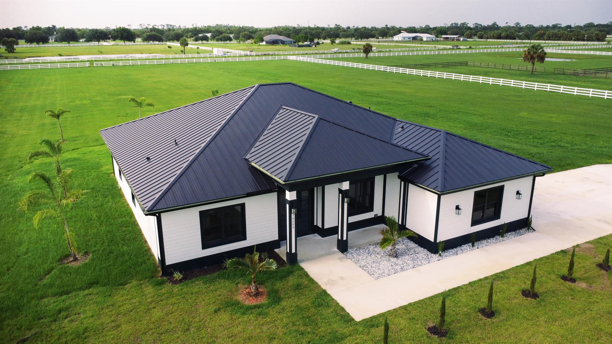 A new construction home! And ready to move in, enjoy a peaceful 5 acres of equine property. Close to St.Lucie County Fair Grounds. Ten minutes away from I-95 and Turnpike. Not only is it a beautiful property, it is also in a wonderful location in close proximity of many upcoming developments near Midway Road. All the while maintaining distance from the city noise. Part of a Neighborhood association with trails for walking, or horse riding.