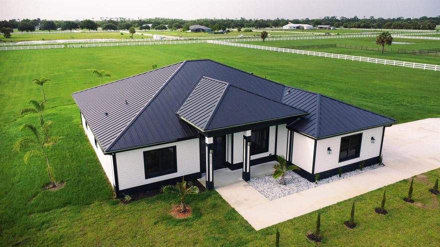 A new construction home! And ready to move in, enjoy a peaceful 5 acres of equine property. Close to St.Lucie County Fair Grounds. Ten minutes away from I-95 and Turnpike. Not only is it a beautiful property, it is also in a wonderful location in close proximity of many upcoming developments near Midway Road. All the while maintaining distance from the city noise. Part of a Neighborhood association with trails for walking, or horse riding.