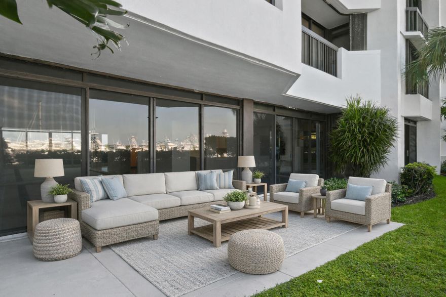 Rarely available first-floor 2BD/2BA waterfront condo offering a true rarity in condo living—your own private wraparound yard. Brand new AC & hot water heater.  Open the sliders and step into total privacy, perfect for morning coffee, sunset views, or letting Fido out with ease. Inside, an open floor plan fills with natural light, featuring spacious bedrooms, spa-like baths, Marina Tower residents enjoy resort-style amenities including a heated pool, spa, social room, covered parking, car wash, 24/7 security, and an on-site marina with Belle's Restaurant. Recent renovations and inspections are complete, making this move-in ready gem the ideal blend of indoor-outdoor living. invitation to savor the serenity of waterfront living. Beyond your doorstep, the scenic two-mile walkway around the marina offers the perfect route for your daily strolls, invigorating jogs, or peaceful evening walks beneath the stars. And for food lovers, indulgence is always within reach an exceptional restaurant is situated right next door, offering fresh flavors and an unbeatable atmosphere. For those craving variety, another local gem awaits just across the street, ensuring world-class dining is always close by. Country Club Living & Premium Amenities For golf enthusiasts and those who appreciate a refined lifestyle, the North Palm Country Club is a short stroll away, providing access to premier golfing, social events, and exclusive amenities. Whether you're perfecting your swing, enjoying a leisurely brunch, or mingling with fellow members, this prestigious club ensures you experience the best of Florida's coastal charm. Inside, the condo boasts a thoughtfully designed open floor plan, maximizing space and natural light. Both bedrooms provide spacious retreats, while the bathrooms are elegantly finished for a spa-like experience. With its unparalleled location, breathtaking views, and luxurious indoor-outdoor flow, this waterfront gem is a rare find that embodies the essence of effortless coastal living.