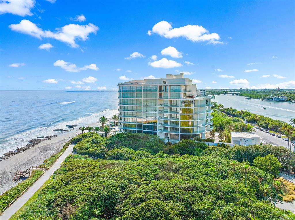 Exceptional opportunity to own this new construction residence in Jupiter Islands one-of-a-kind SeaGlass Condominium. Construction completed in 2022, being the first new condominium development in over 20+ years on Jupiter Island. Only 21 total residences offering uncompromised luxury, breathtaking views while also offering unprecedented privacy. This property is located between the ocean, Intracoastal, and lush protected landscapes. Residence 501 offers a large open floorplan with floor to ceiling glass creating a stunning ocean to Intracoastal panoramic view as you enter through the private Foyer. The ''01'' floorplan is 3 Bedrooms, 4.5 baths, with a Den, all bedrooms include ensuite baths, walk-in wardrobes and water views . Other features include three expansive terraces,