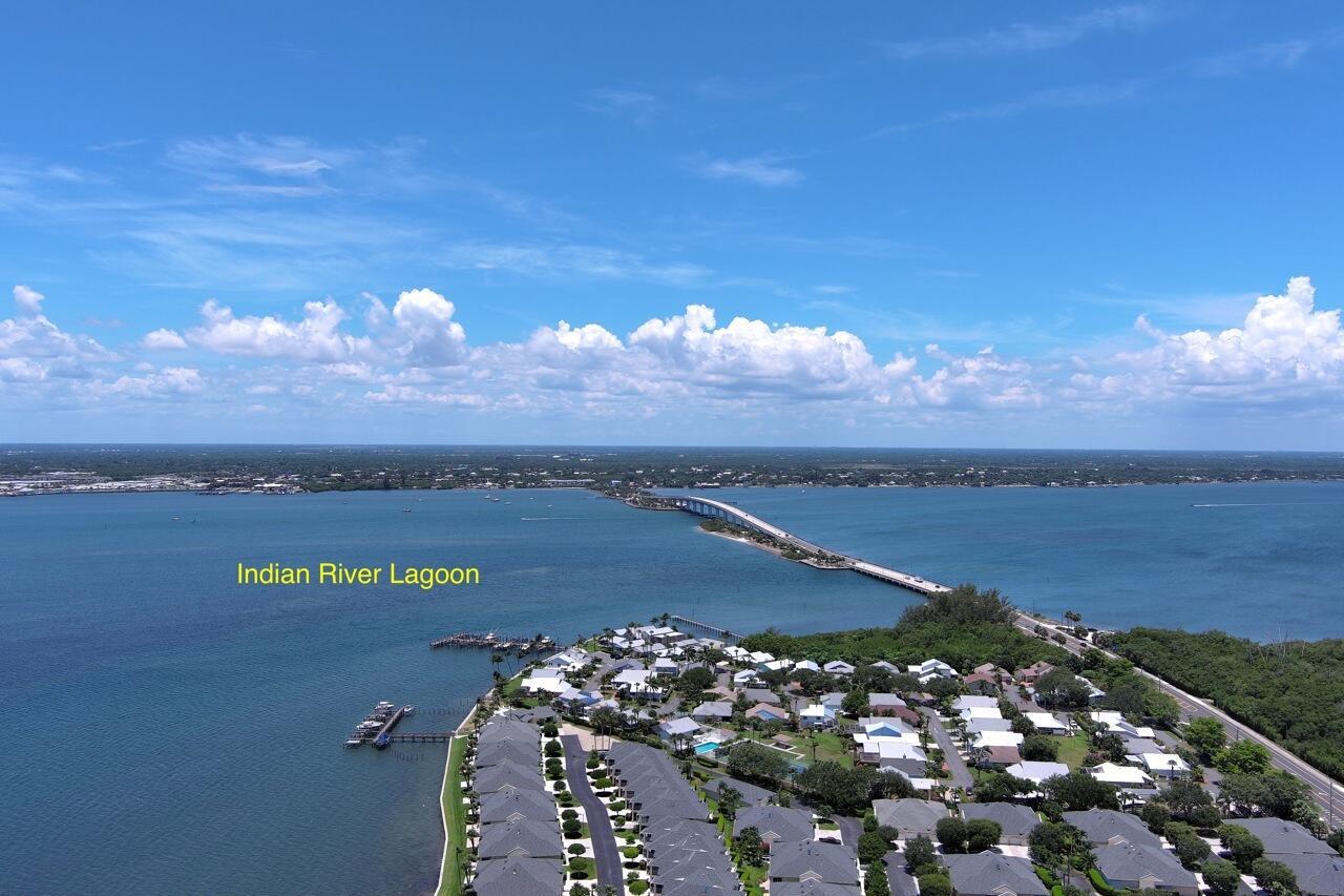 STUNNING! This 1st floor condo will take your breath away. Your piece of paradise awaits! Wide water views from every room and the condo has been decorated and upgraded to reflect peaceful river front living. You'll step in to soft colors, beautifully updated kitchen with granite counters and updated appliances. The split plan allows for privacy and tastefully updated bathrooms entice with spa-like colors and features. Covered parking space right in front of your entrance. Community has a heated pool, clubhouse with full kitchen, meeting room, fitness room, billiards and shuffleboard. Excellent location within walking distance to the beach or fish from the docks in the community. Close to downtown shopping and restaurants.