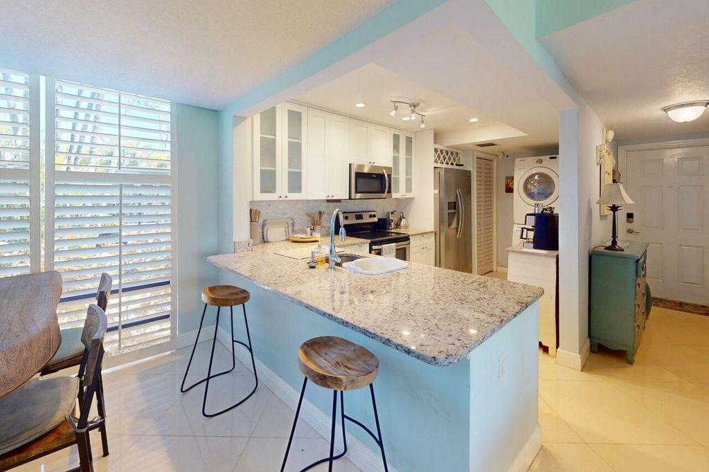 Photo of 3492 NE Causeway Boulevard #104, Jensen Beach, FL 34957 (MLS # R11101465)