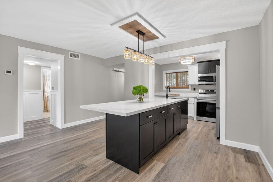 Welcome home to this beautifully renovated first-floor end-unit in the Boca Terrace community, where tranquil water views and abundant natural light create an inviting and elevated living experience. Thoughtfully designed, the stunning kitchen serves as the heart of the home, featuring an oversized island with additional storage, ample cabinetry, sleek quartz countertops, new stainless steel appliances, and stylish custom finishes throughout. A pantry at the entry adds everyday convenience, while details like wainscoting in the hallway bring warmth and character. The updated bathrooms continue the home's refined feel, and the living areas open to a screened patio—perfect for relaxing and enjoying the peaceful lakefront setting. Boca Terrace is a well-established East Boca community known for its serene lake views, lush green space, and amenities including pools, tennis/pickleball, and clubhouse facilities. Zoned for A-rated schools—Addison Mizner, Boca Raton Community Middle, and Boca Raton Community High. Ideally located just minutes from shopping, dining, I-95, and Boca's beautiful beaches.