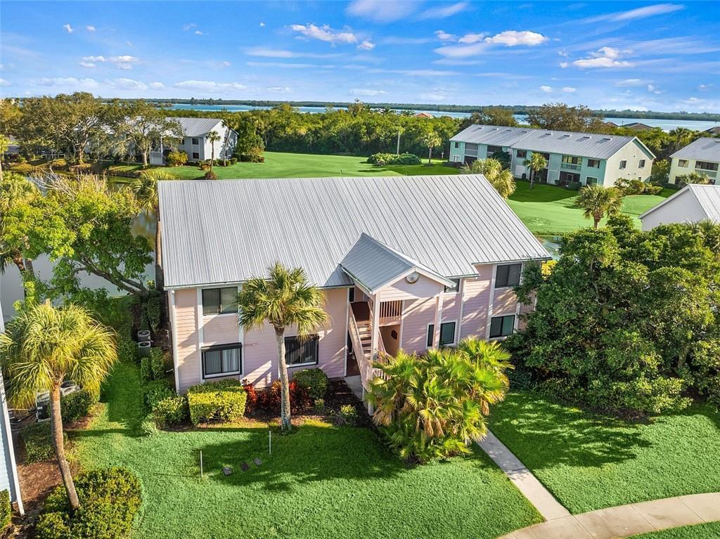 This adorable turnkey 2BR/2BA condo offers lake & golf course views, cathedral ceilings and no overhead neighbors! Updated kitchen features white Shaker cabinetry, quartz countertops & SS appliances. Newer stackable washer/dryer, A/C, HWH; impact-resistant windows; screened porch w/insect screens. Enjoy free, unlimited golf, a putting green, tennis, pickleball, bocce ball, a heated pool, walking trails, marina with free boat dock and resident-led activities like poker, mahjong, book clubs, ladies, men's & mixed golf leagues. Benefit from on-site maintenance, pest control & secure gate access.