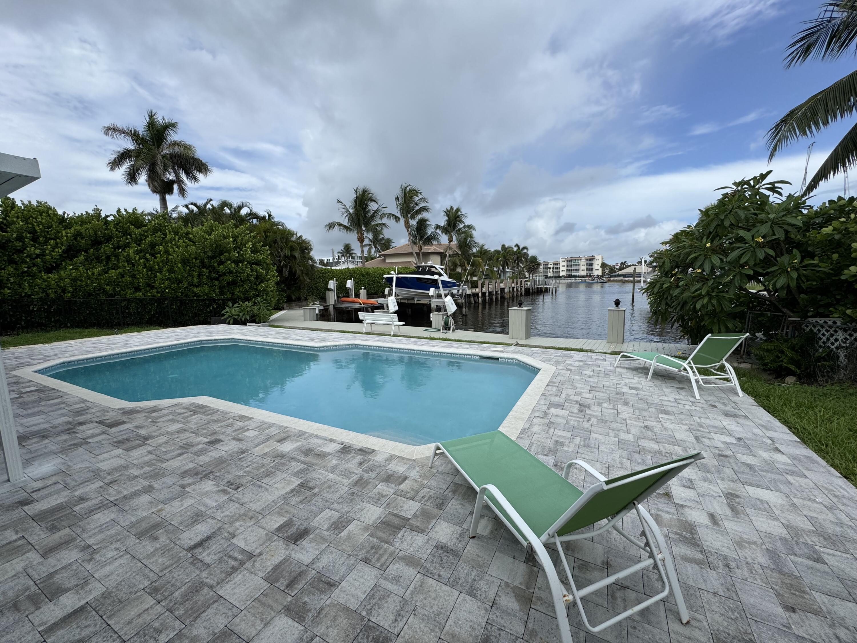 Welcome to your dream home in the heart of Ocean Ridge! This charming 2-bedroom, 2-bathroom residence offers 1,453 sq. ft. of beautifully designed living space, featuring a stunning pool with views of the Intracoastal. Animals are welcome. Just a five-minute walk to the ocean, where you'll have exclusive private beach access. 10-minute drive to downtown Delray Beach with shopping and restaurants.Don't miss this rare opportunity to own a slice of paradise in one of South Florida's most desirable coastal communities!