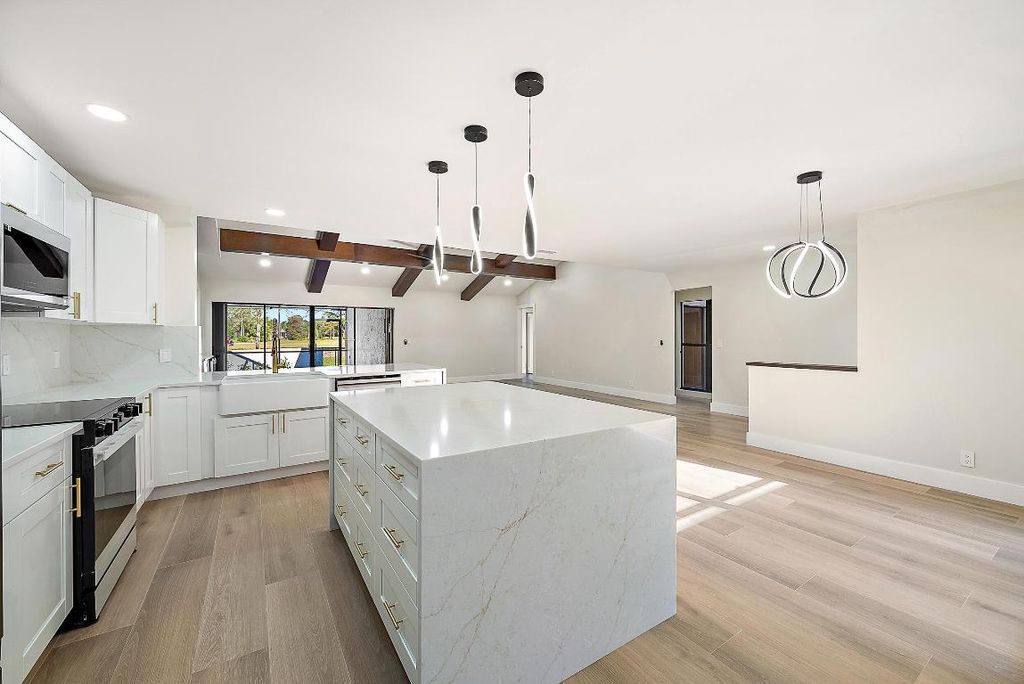 Photo of 37 Edinburgh Drive, Palm Beach Gardens, FL 33418 (MLS # R11155091)