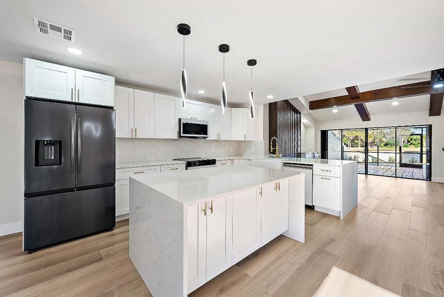 Welcome to 37 Edinburgh, one of a kind fully remodeled, large single story townhome in the highly sought after PGA National. Enjoy both serene lake views with expansive golf course fairways in your backyard. Homes like these are rarely available in Edinburgh. Perfectly
located near Ryder Cup gate for easy access to turnpike/ i95 as well as Publix & all the shopping Palm Beach Gardens has to offer.