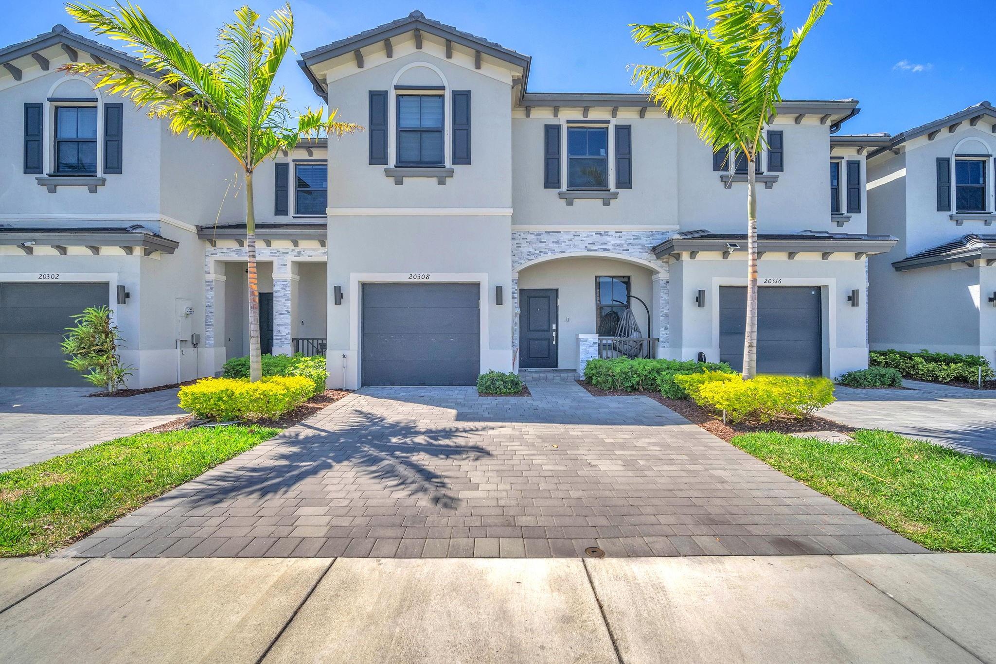 This bright and spacious townhouse offers 4 bedrooms, 2.5 bathrooms, and a 1-car garage. Designed with an open-concept layout, it features large windows that fill the home with natural light, highlighting sleek stainless steel appliances and elegant quartz countertops. Step outside to a private patio, perfect for relaxing or entertaining. Nestled in a gated community with resort-style amenities—including a fitness center, pool, and clubhouse—this home provides easy access to top-rated schools, shopping, parks, and Hard Rock Stadium. Don’t miss out—schedule your viewing today!