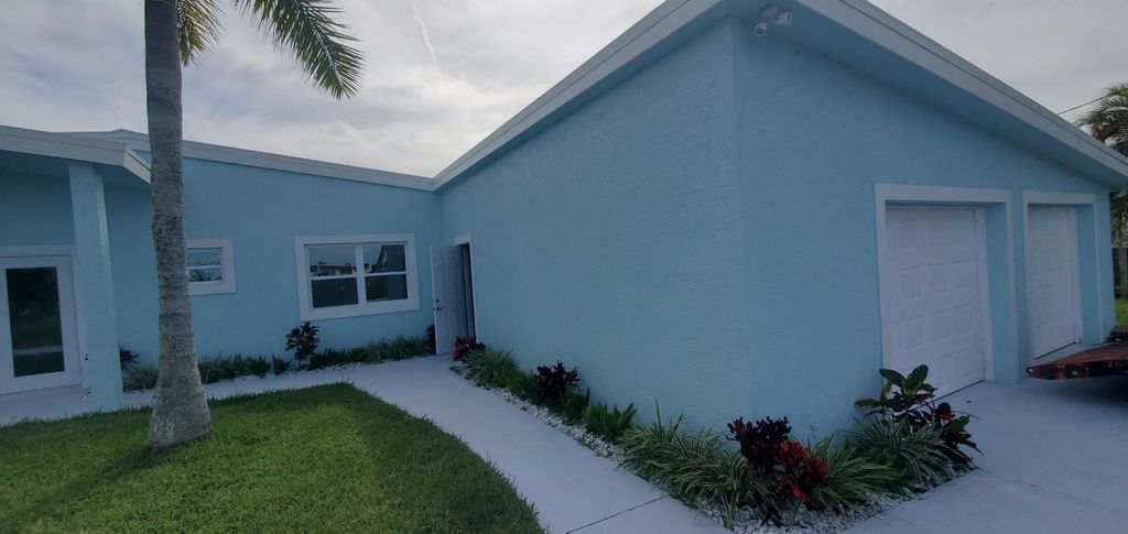 Photo of 1529 Thumb Point Drive, Fort Pierce, FL 34949 (MLS # R10979401)