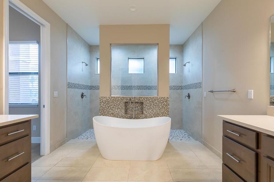 MAJOR PRICE REDUCTION!!!! CORPORATE OWNER. Wonderful 5 bedroom, 3 bath, 2 car garage home. Features include full impact glass windows and sliders, fenced in yard, tile flooring in all living areas and bathrooms, vinyl flooring in bedrooms. Tile and glass inserts in all baths, all cabinets upgraded to level 4 (even laundry room) with self-close doors and drawers. Quartz tops in kitchen and baths, stainless steel appliances, washer & dryer conveys.  This home will not disappoint. Some photos have been virtually staged.