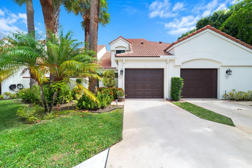 LOCATION, LOCATION, LOCATION!! WALK TO THE BEACH!!    This beautifully maintained and thoughtfully upgraded residence offers a bright, open interior with vaulted ceilings, plantation shutters, and porcelain tile flooring throughout the main level, complemented by new carpet upstairs. A complete home renovation in 2016 included new light fixtures, ceiling fans, and the removal of polybutylene piping and the original water heater. The spacious layout features lofty two-story main-level living. Entry through the private courtyard which leads to an open floor plan that flows seamlessly to the rear screened patio and pool area with a privacy wall--ideal for both relaxing and entertaining. Additional upgrades include a new HVAC system (2021),