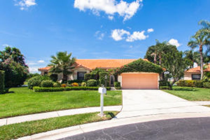 Custom Built 4 bed 2.5 bath Lakefront pool home in gated community. Heathered Oak floors thru out mixed with ceramic tile. Newer roof and all systems in great working order. Cathedral ceilings. Upgraded kitchen and baths with custom granite and cabinets. Nice split bedroom plan. Open floorplan with formal living and great rooms overlooking covered lanai and lake/pool views. Wonderful curb appeal with lush landscape and Koi pond. Screened pool enclosure with fully maintained equipment. Solar cover for pool. Accordian hurricane shutters thru out. Stainless appliance package in kitchen. Nice formal master bedroom with cathedral ceilings and extra large master bath with skylights. Custom lighting in kitchen. HOA maintains common areas and individual landscape and trimming.  MUST SEE!!