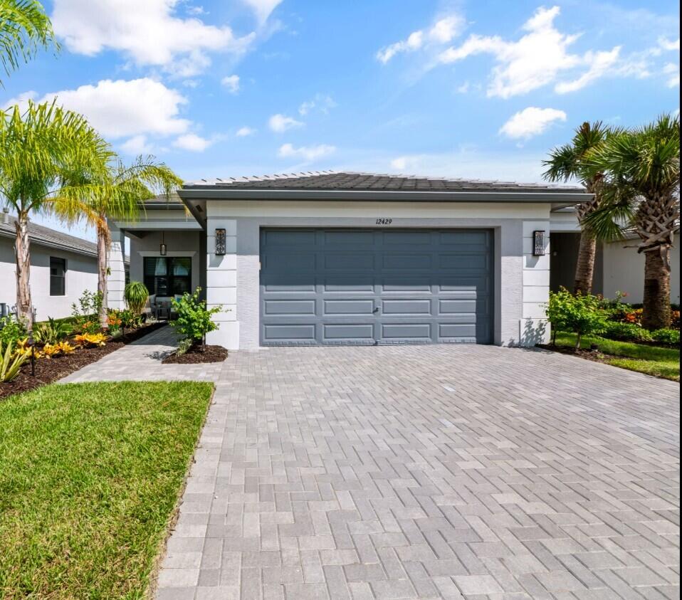 Photo of 12429 SW HIGH TIDE Road, Port Saint Lucie, FL 34987 (MLS # B26080046)